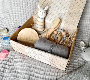 Classic gift box with wooden stacking toy, announcement disc, brush, teether and muslin